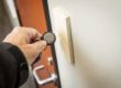 picture of man using a key fob to open a door