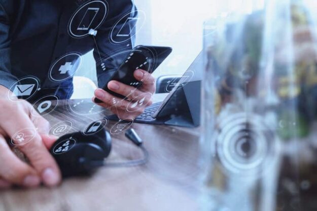 business person working with a voip phone business person working with a voip phone