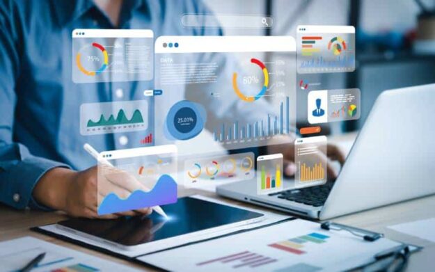 An analyst using a computer and dashboard for data business analysis and Data Management System.