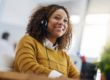 Smiling Black woman wearing a voip headset for consulting.